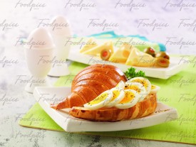 Boiled Egg Sliced boiled eggs on croissant image preview