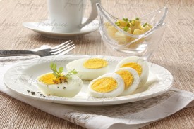 Boiled Egg Slices of boiled egg in a plate with cheese cubes preview